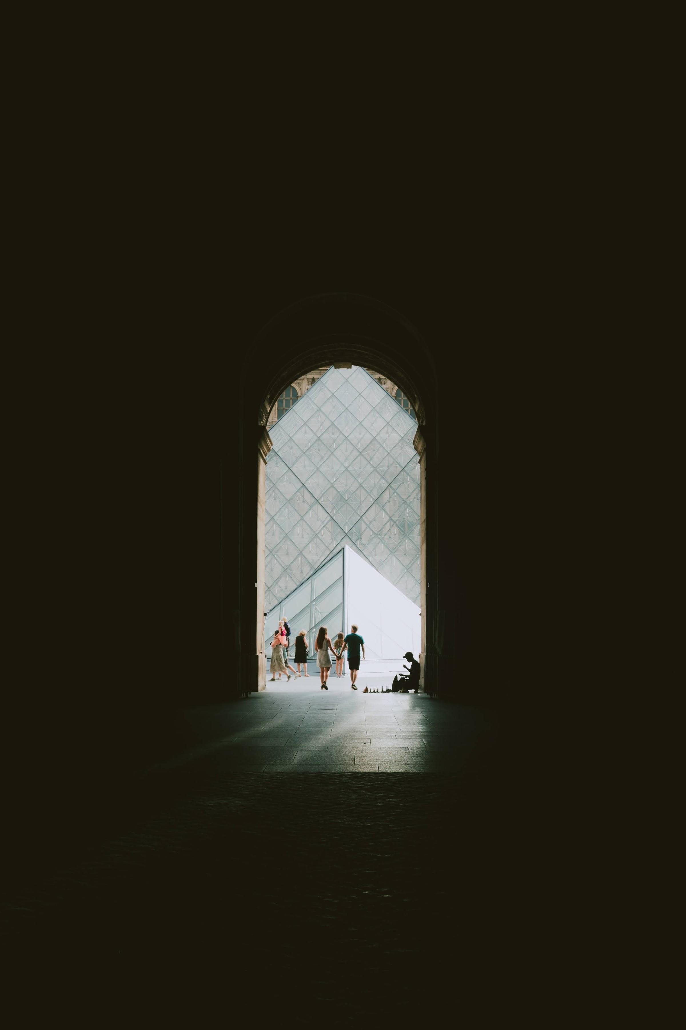 Couple holds hands in Paris